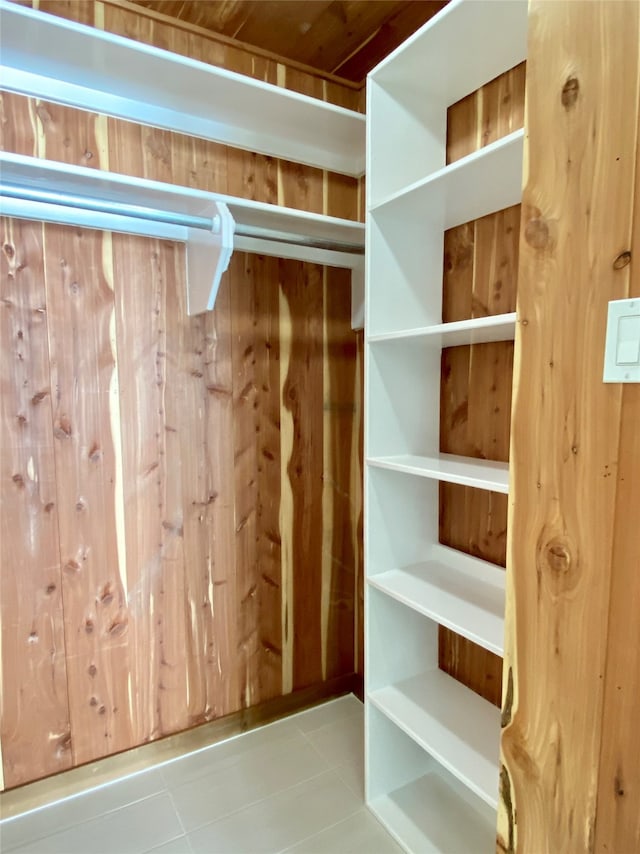 spacious closet featuring tile patterned flooring