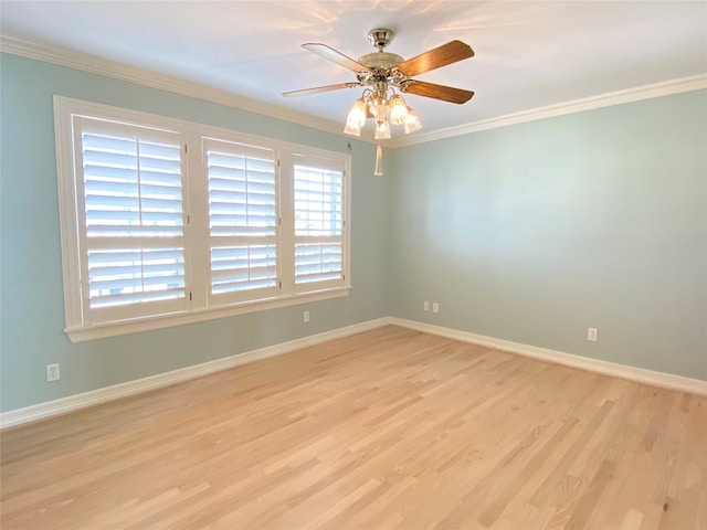 empty room featuring light wood-type flooring, ceiling fan, and crown molding