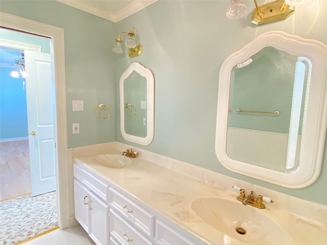 bathroom featuring ceiling fan, vanity, and crown molding