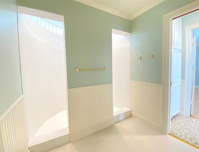 bathroom featuring ornamental molding and walk in shower