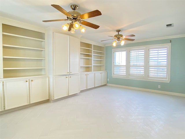 interior space with built in shelves, ornamental molding, and ceiling fan