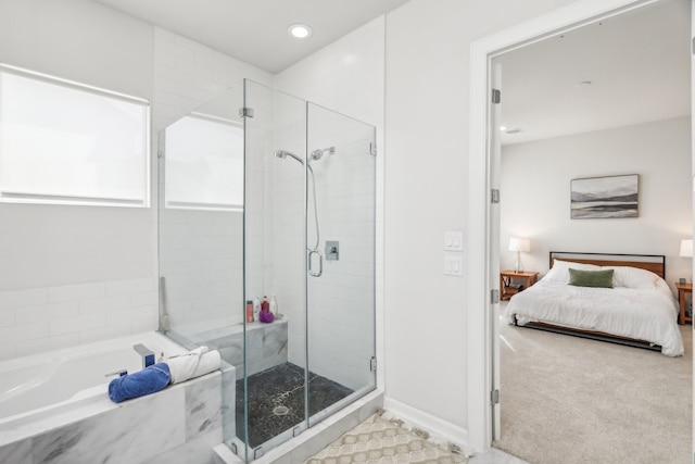 bathroom featuring independent shower and bath