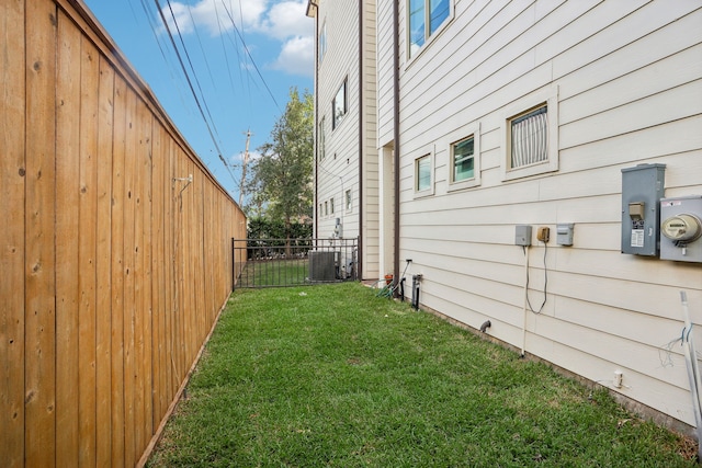 view of yard featuring central air condition unit