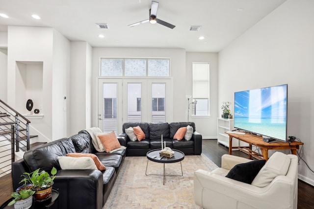 living room featuring ceiling fan, hardwood / wood-style flooring, and a wealth of natural light