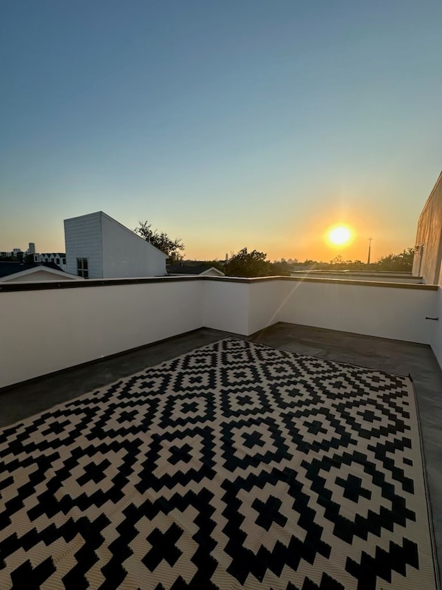 patio terrace at dusk with a balcony