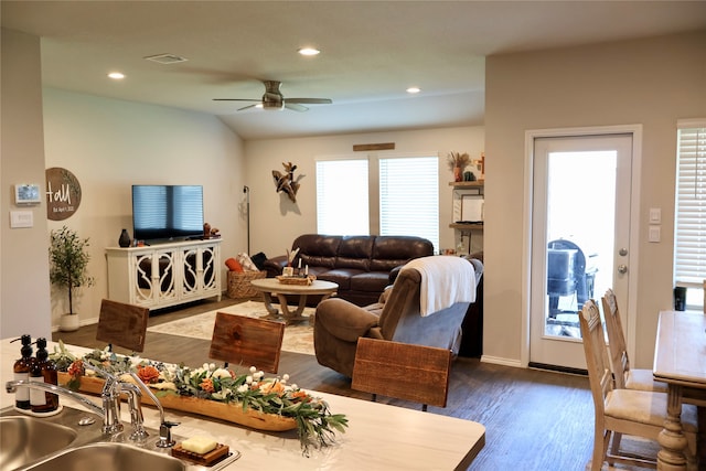 living room with ceiling fan, sink, and dark hardwood / wood-style flooring