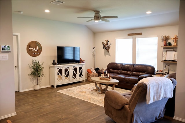 living room featuring ceiling fan, lofted ceiling, and dark hardwood / wood-style flooring