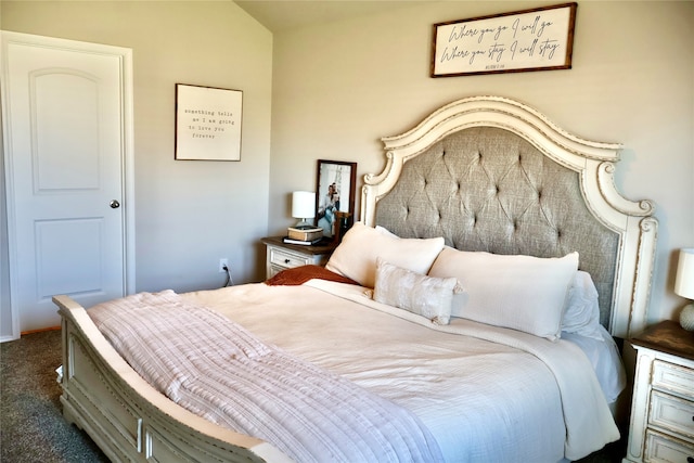 carpeted bedroom featuring vaulted ceiling