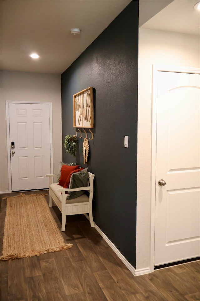 corridor featuring dark wood-type flooring