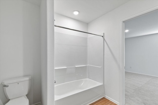 bathroom with toilet and  shower combination