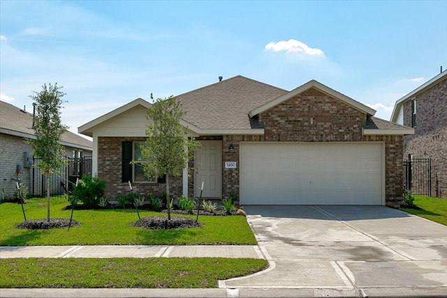 view of front facade featuring a front yard and a garage