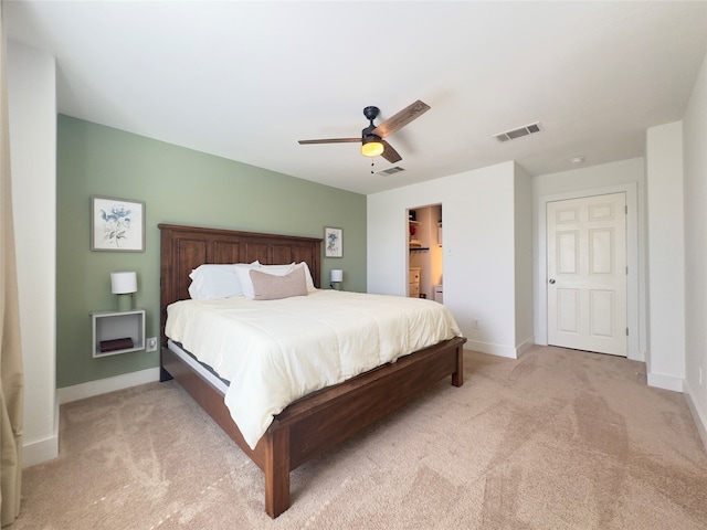 bedroom featuring ceiling fan and light colored carpet