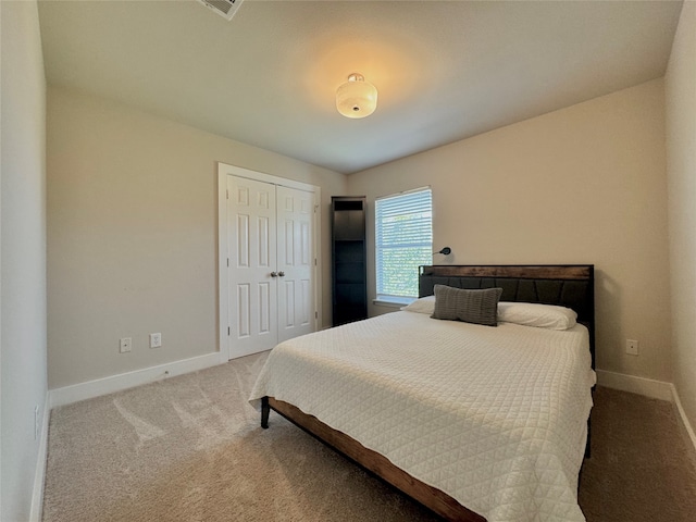 carpeted bedroom featuring a closet