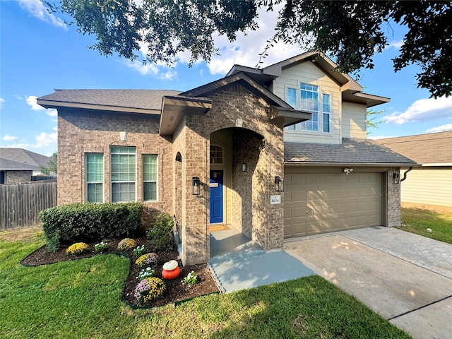 view of front facade featuring a garage and a front yard