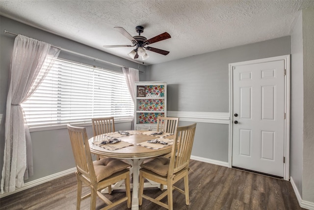 dining room with ceiling fan, a textured ceiling, and dark hardwood / wood-style floors