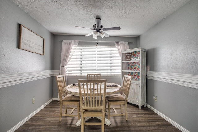 dining area featuring a textured ceiling, ceiling fan, and dark hardwood / wood-style flooring