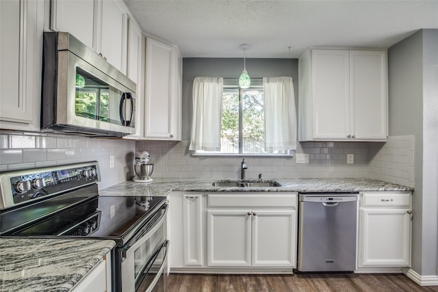 kitchen featuring white cabinetry, sink, and stainless steel appliances