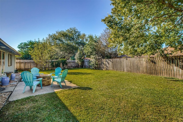 view of yard with a patio area and an outdoor fire pit