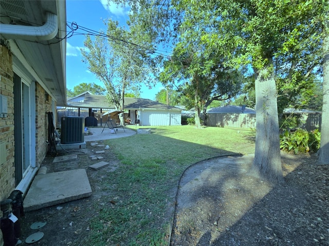 view of yard with a patio and central AC unit