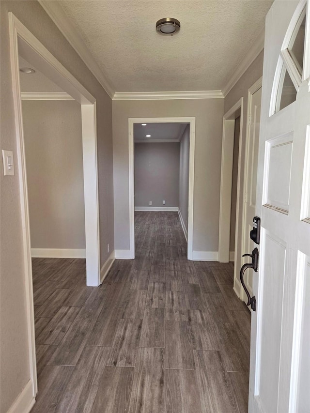 hall with crown molding and dark hardwood / wood-style floors