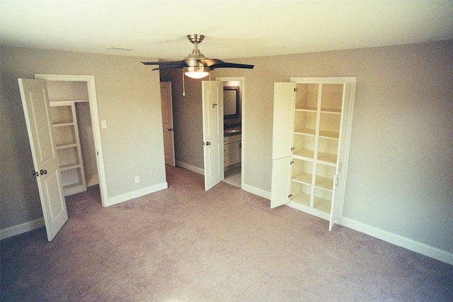 unfurnished bedroom featuring carpet floors, ceiling fan, and baseboards