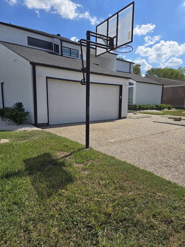 garage with a lawn