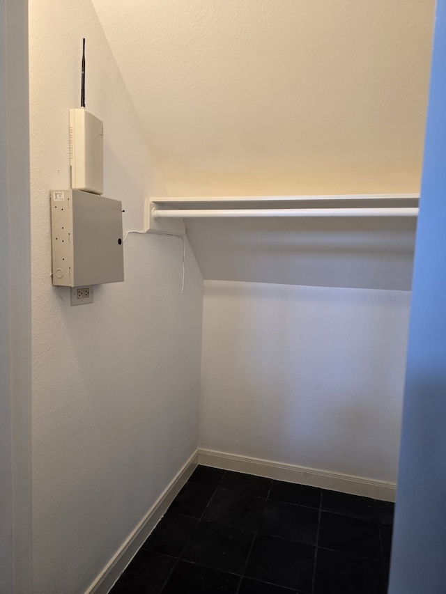 spacious closet featuring tile patterned flooring