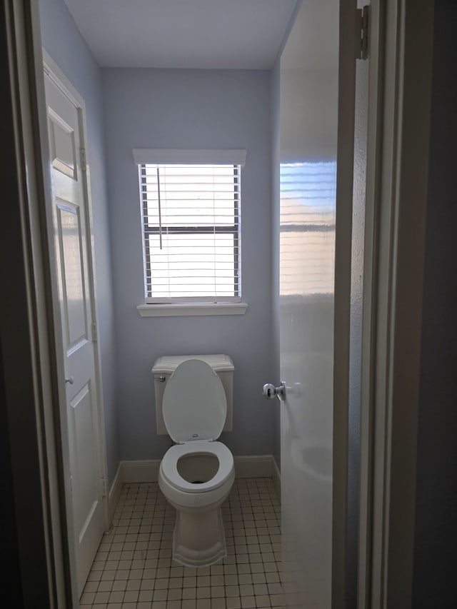 bathroom featuring tile patterned flooring and toilet