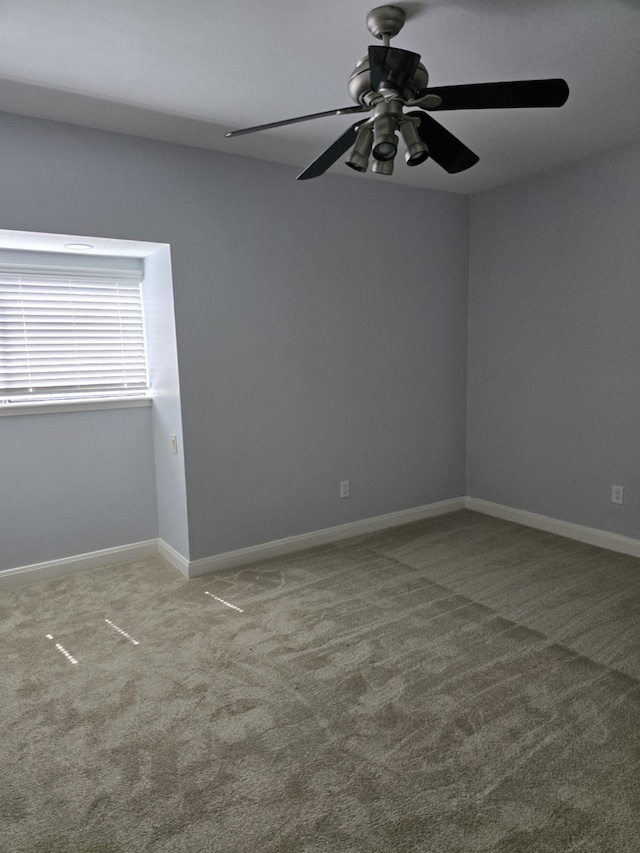 carpeted empty room with ceiling fan