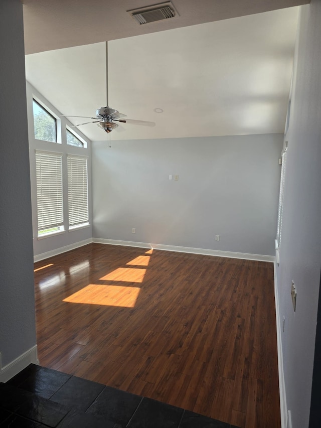 unfurnished room featuring ceiling fan, lofted ceiling, and dark hardwood / wood-style flooring