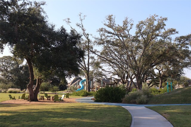 view of community with a playground and a yard