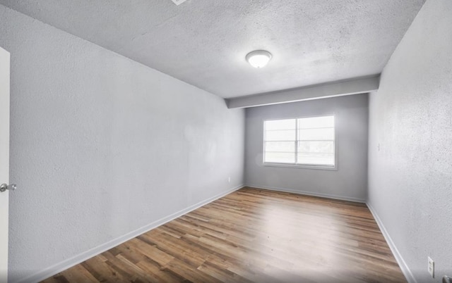 7019 Anderson St, Texas City, TX 77591 - unfurnished room featuring a textured ceiling and hardwood / wood-style flooring