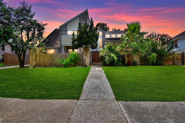 view of front of house with a yard