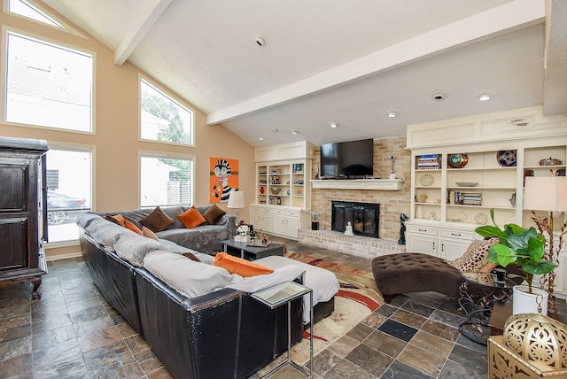 living room with vaulted ceiling with beams, built in features, and a brick fireplace