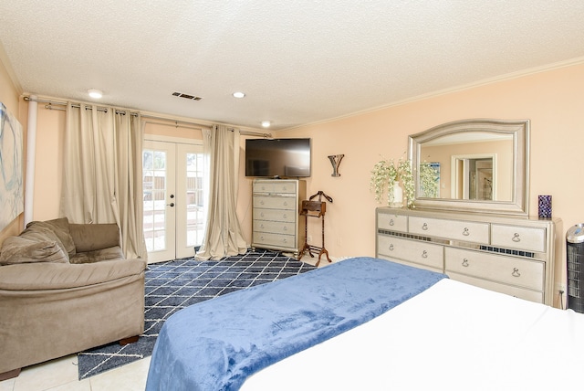 tiled bedroom with access to outside, a textured ceiling, and french doors