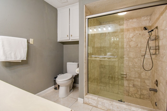 bathroom with tile patterned floors, a textured ceiling, an enclosed shower, and toilet