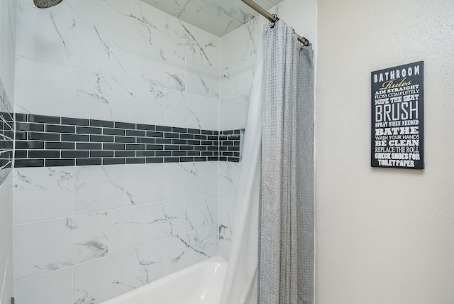 bathroom featuring shower / bathtub combination with curtain