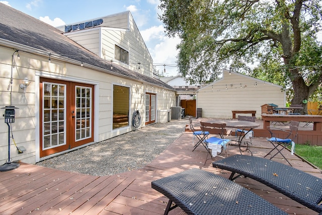 wooden terrace featuring cooling unit