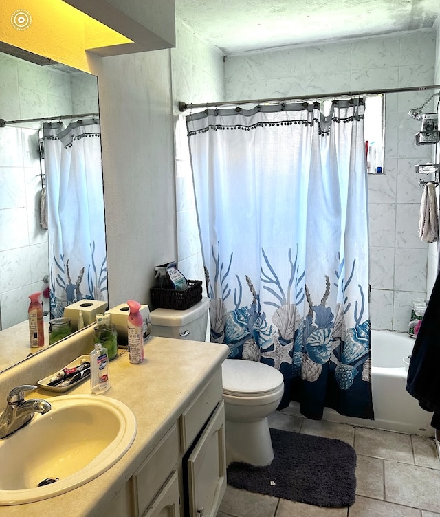 full bathroom with vanity, shower / tub combo, and toilet