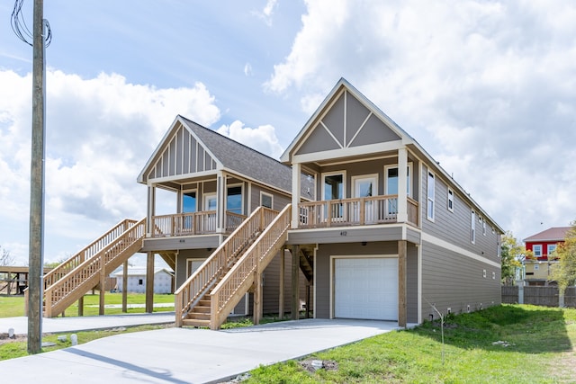 view of front facade featuring a porch, a garage, and a front lawn