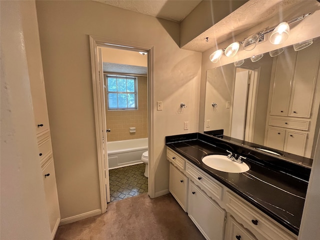 full bathroom featuring tile patterned floors, vanity, toilet, and tiled shower / bath