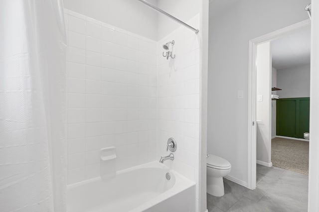 bathroom with shower / bath combo and toilet