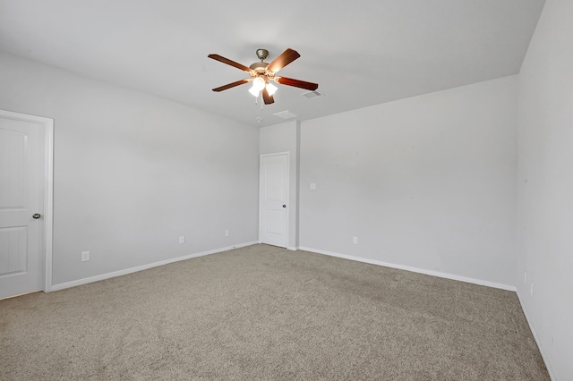 unfurnished room with ceiling fan and carpet floors