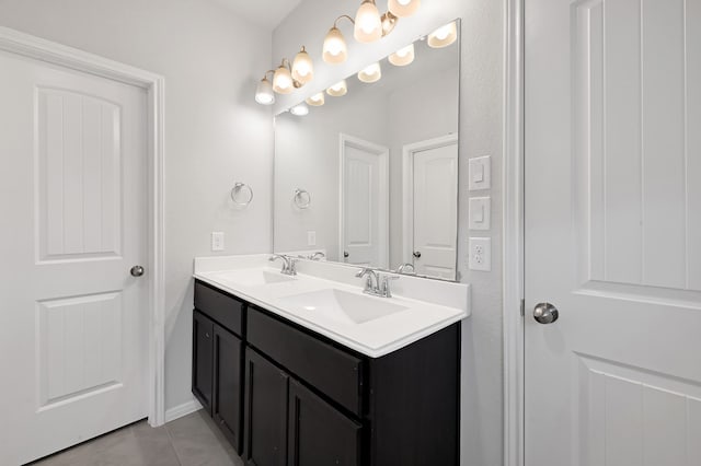 bathroom with tile patterned flooring and vanity