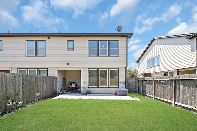 back of house featuring a yard, a patio area, and central air condition unit