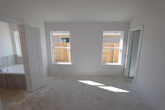 spare room with lofted ceiling