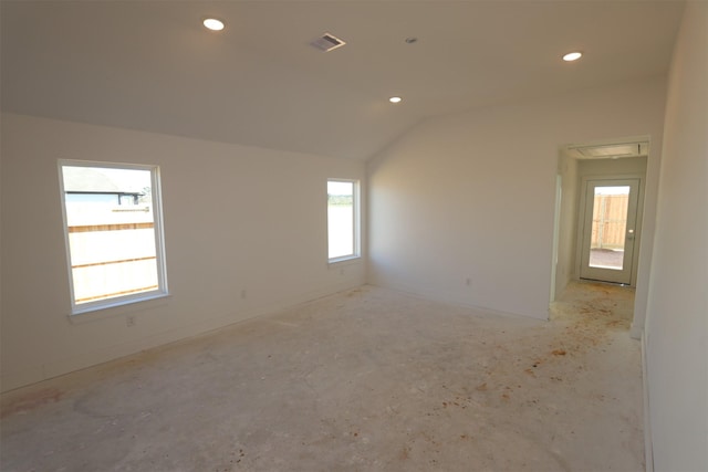 empty room with vaulted ceiling