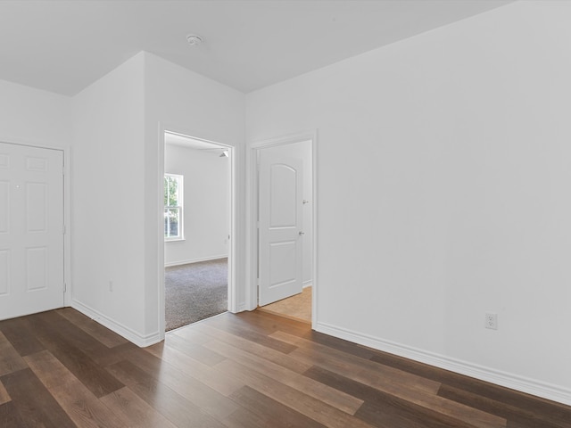 spare room featuring dark hardwood / wood-style floors