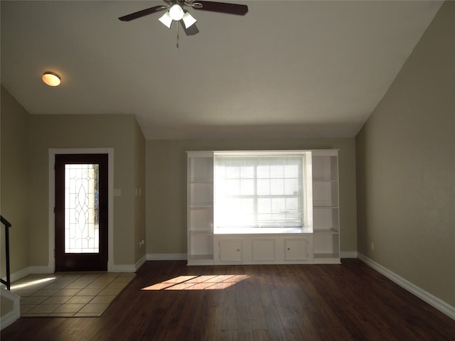 foyer featuring a healthy amount of sunlight, ceiling fan, and hardwood / wood-style floors