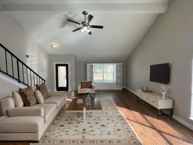 living room with lofted ceiling, dark wood-type flooring, and ceiling fan